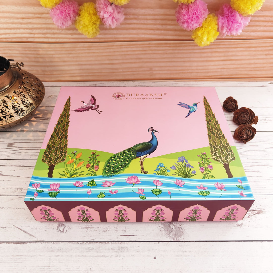 Decorative box with peacock design on a wooden surface with decorative elements.