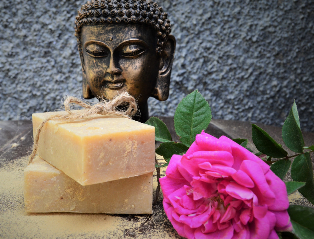 Himalayan Clay and Rose Soap with a pink rose next to it